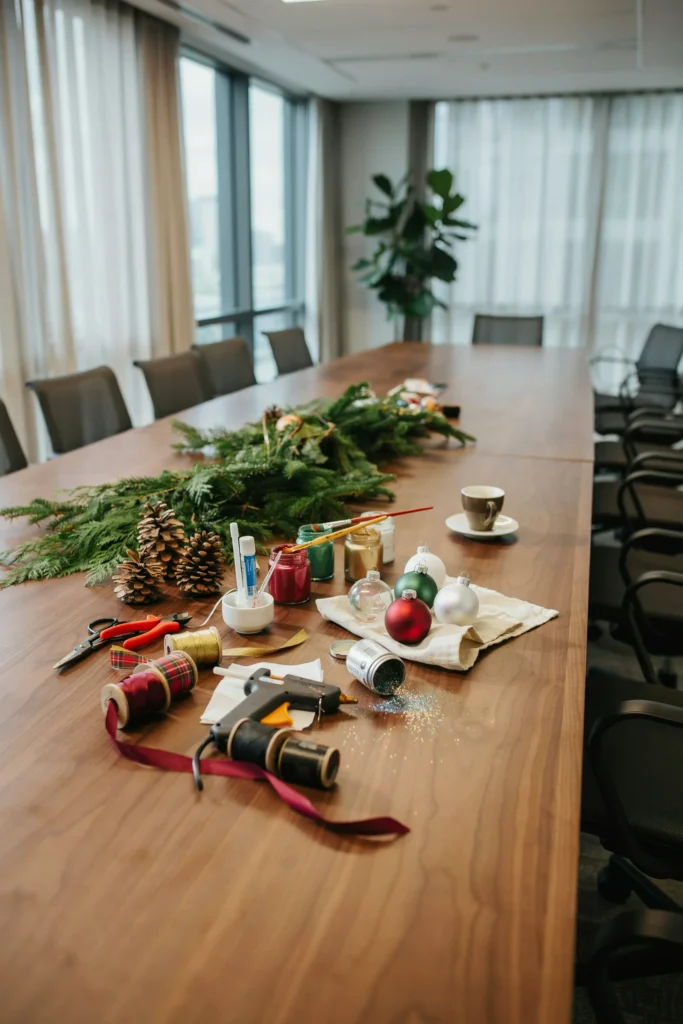 Coworkers making Christmas ornaments together during an office craft break