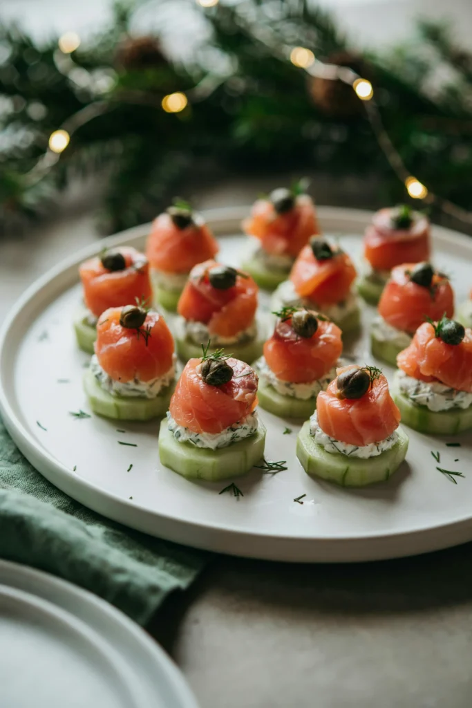 Smoked salmon cucumber rounds topped with dill cream cheese and capers