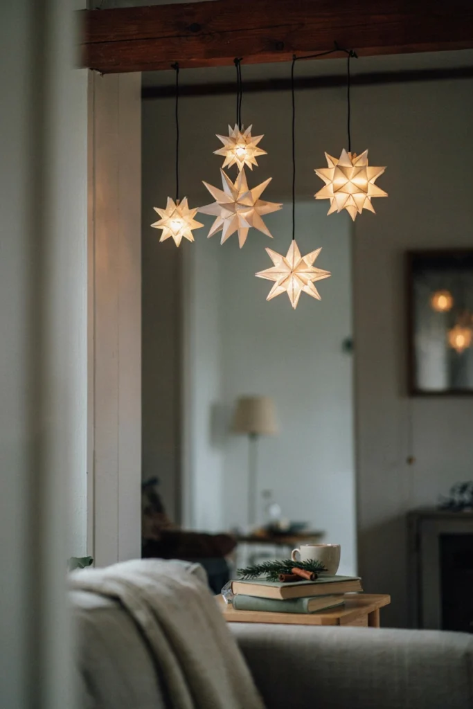 Geometric white paper star lanterns hanging in an entryway