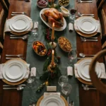 15 Christmas Tablescape Ideas for At-Home Parties high-level-description-an-overhead-iphon_WrOCu8mmW82dj_-7tf1xDg_n20xfUDvQjOEjF0K8TDDSA_cover