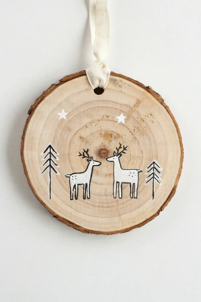 Whitewashed wood slice Christmas ornaments with hand-painted reindeer