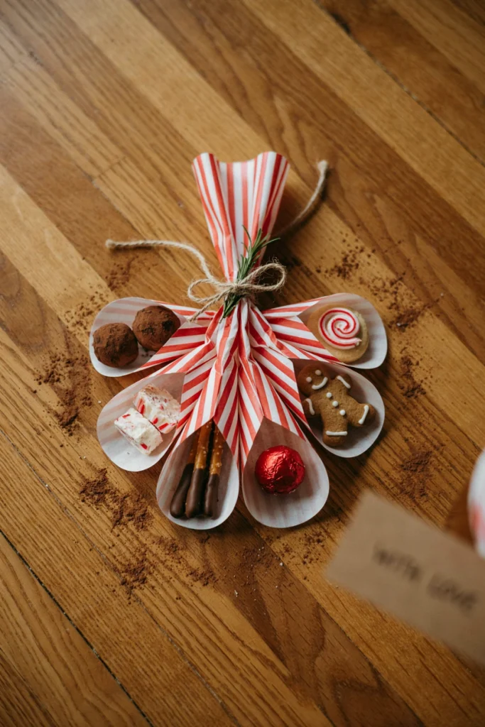 Red and white striped paper muffin liners gathered and tied into a cluster with cookies inside