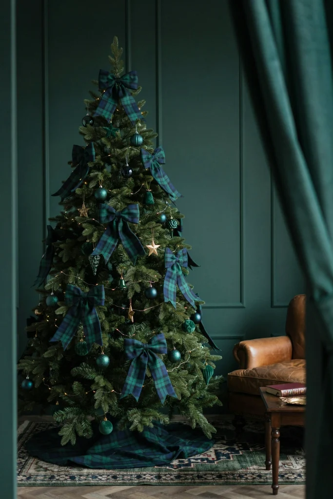 Ralph Lauren Christmas tree decorated with oversized navy and green Black Watch plaid bows